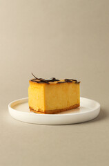 Slice of pumpkin pie on a white plate