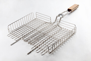 metal grill basket isolated on gray background, top view