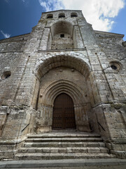 othic facade and bell tower of San Juan Bautista Church in Palenzuela