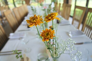 Floral Centerpiece on a White Dining Table