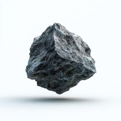 Dark gray, cube-shaped rock, seemingly floating, against a bright white background.  Textured surface, rough edges