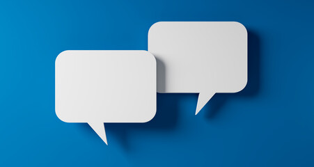 Fototapeta premium Two white speech bubbles resting on a blue colored background - 3D illustration