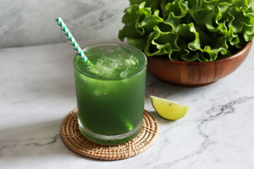 Green vegetable juice glass with fresh veggie. Healthy drinking, detox and antioxidants concept.