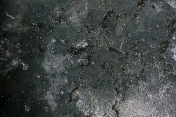 Old concrete wall with rough gray texture and detailed surface patterns