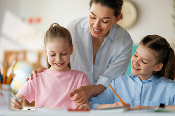 Fototapeta premium Happy kids and teacher at school