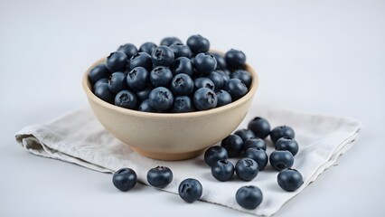 Blueberries in a bowl on white background. 
