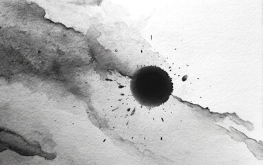Abstract grayscale ink splatters on paper