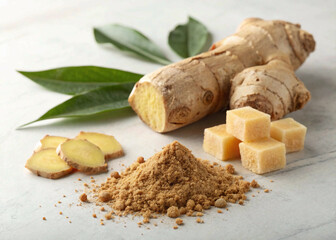 Fototapeta premium A culinary composition of a whole ginger root, ginger powder, and ginger-flavored candy on a light surface.