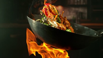 Super Slow Motion of Flying Asian Meal with Meat and Vegetable. Filmed on High Speed Cinema Camera, 1000 fps. Blur Kitchen Interior on Background.  - Powered by Adobe