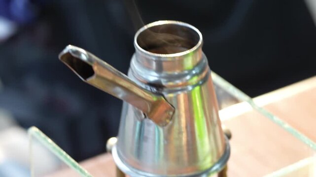 A coffee pot for brewing coffee, a traditional coffee pot such as those used in Ethiopian coffee ceremonies