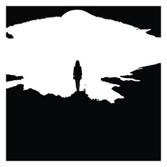 Obraz premium Lone figure against a vast mountain silhouette
