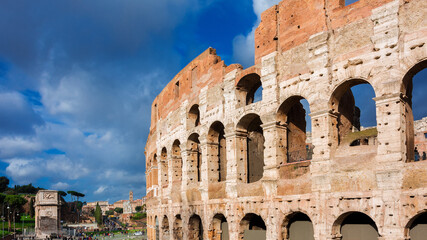 Coliseum ancient ruins with triumphal arches in the center of Rome