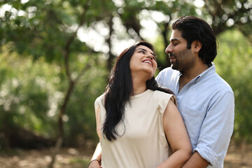 Obraz premium Couple Enjoying A Joyful Moment In A Natural Setting