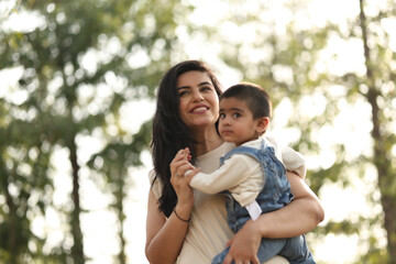 Fototapeta premium Mother And Child Enjoying A Sunny Day Outdoors