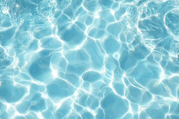 Obraz premium Light reflecting on rippled, light-blue water surface