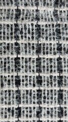 Handmade Woven Cushion with Geometric Blue and Gray Pattern, Thread Texture, Glitter Detail, Close-Up Macro Textile Art