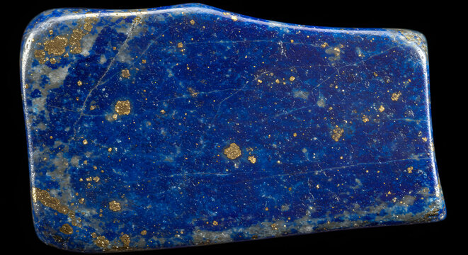 Close-up reveals the beauty of a polished lapis lazuli stone, showcasing its deep blue color and golden pyrite inclusions on black background, capturing the richness and natural elegance.