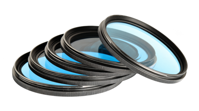 A professional studio arrangement featuring a set of fice circular blue optical glass lenses precisely engineered for cameras or scientific instruments to manipulate light.