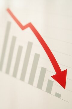 negative revenue rate concept. Declining graph with red arrow indicating a downward trend.