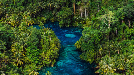 Most transparent lake with blue fresh water in Indonesia. Drone above view