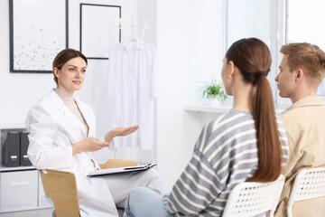 Fototapeta premium In vitro fertilization (IVF). Couple having appointment with doctor in reproductive clinic