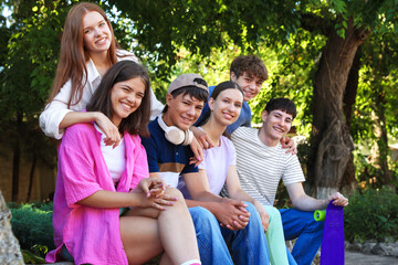 Portrait of happy teenage friends together outdoors