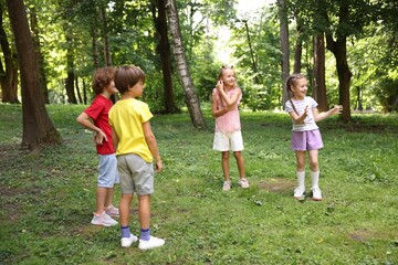 Obraz premium Cute little kids having fun together in park