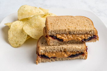 peanut butter and jelly sandwich with   potatoe chips