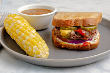 hamburger sandwich with pickles and everything