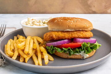 chicken fillet sandwich  with  macaroni salad and fries