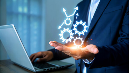 Businessman strategizing growth with digital gears and upward trending graph, symbolizing business progress and innovation