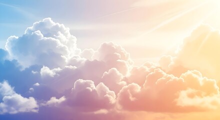 Dreamy skyscape featuring fluffy white clouds illuminated with pastel hues of blue, pink, and orange.