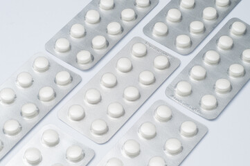 Pill blister packs laying in a rows. Treatment and medication concept. Blister packages.
