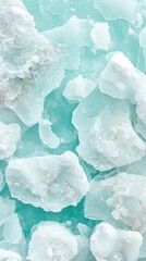 Obraz premium Frozen ice fragments float upon light turquoise cold water. Crushed ice reflects sunlight within the Arctic region. Clean cold ice abstract background.