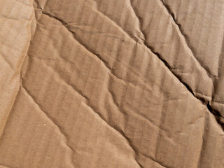 Creased crumpled brown cardboard paper texture background design element