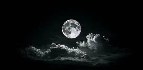 A full moon and dense clouds create a dramatic night sky