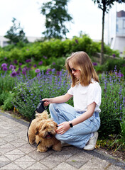Little Girl in City Park Walking Playing with her Havanese Bichon-type Dog Seasonal Summer