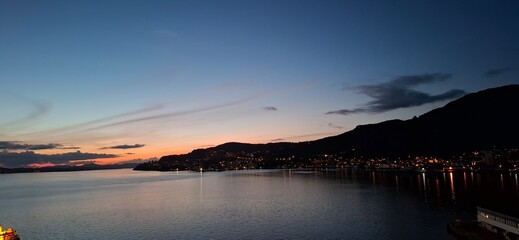 invergordon united kingdom Serene Sunset View Over Coastal Town With Calm Waters