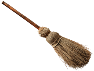 Old rustic witchs broomstick with a weathered wooden handle and natural straw bristles.