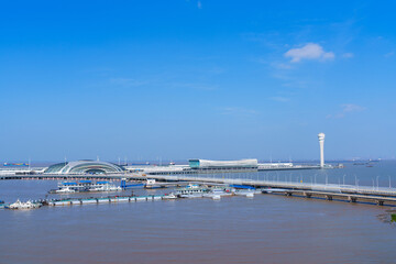 The scenery of Shanghai Wusongkou International Cruise Port under the blue sky and white clouds