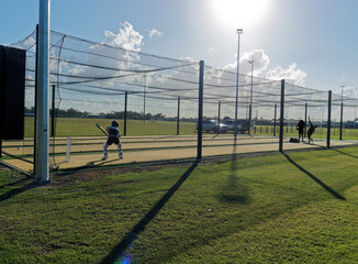 Cricket training and practice in the nets for left handed female cricket player