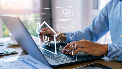 Man managing property insurance online, checking security features on digital interface for smart home protection and investment management.
