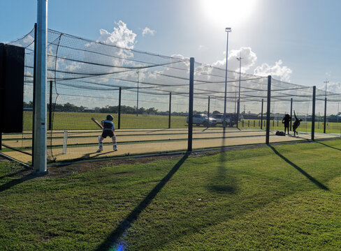 Cricket training and practice in the nets for left handed female cricket player