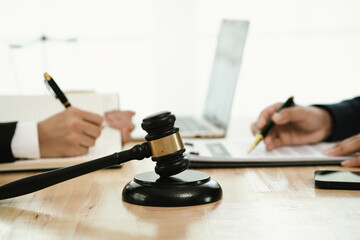 A professional lawyer discusses legal contracts with a client in an office, focusing on justice, finance, agreements, and courtroom guidance, offering expert advice, consultation, and business decisio