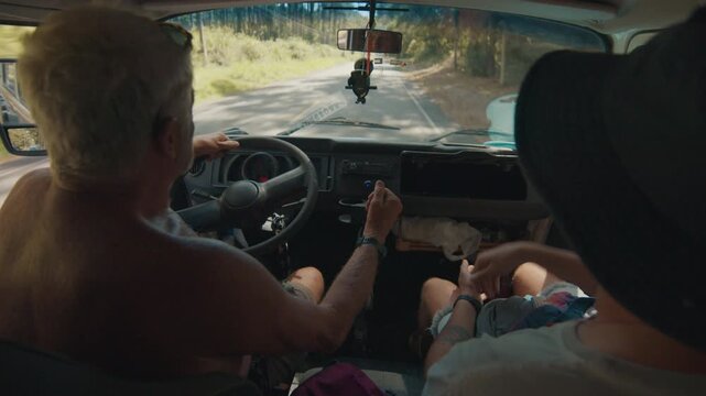 Two hippies travel by the old classic bus in Brazil. Elderly and young men travel by the retro classic car and talk