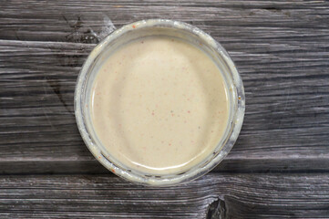 Tahini Tahina which is a Middle Eastern condiment made from toasted ground hulled sesame, served by itself (as a dip), with spices and herbs, Seafood Tahini used as a dip and an appetizer side plate