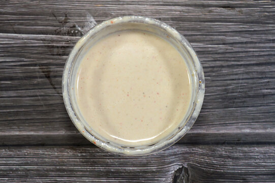 Tahini Tahina which is a Middle Eastern condiment made from toasted ground hulled sesame, served by itself (as a dip), with spices and herbs, Seafood Tahini used as a dip and an appetizer side plate