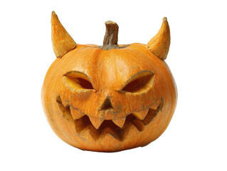 Scary carved Halloween pumpkin with a devilish face sharp teeth and prominent horns.