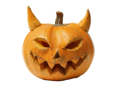 Scary carved Halloween pumpkin with a devilish face sharp teeth and prominent horns.