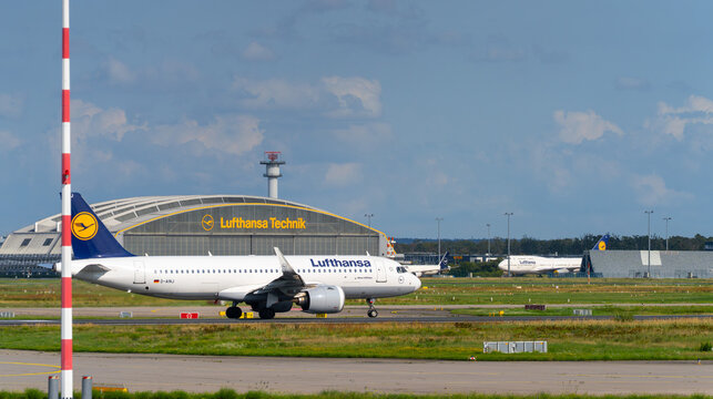 German Lufthansa Airbus A320neo commercial Aeroplane in front of lufthansa technik building